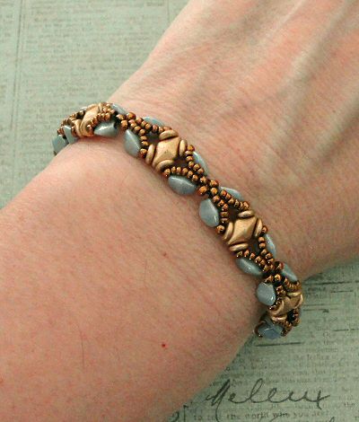 a woman's arm with a bracelet on it