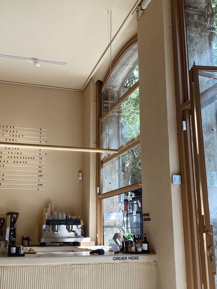 the inside of a coffee shop with lots of windows