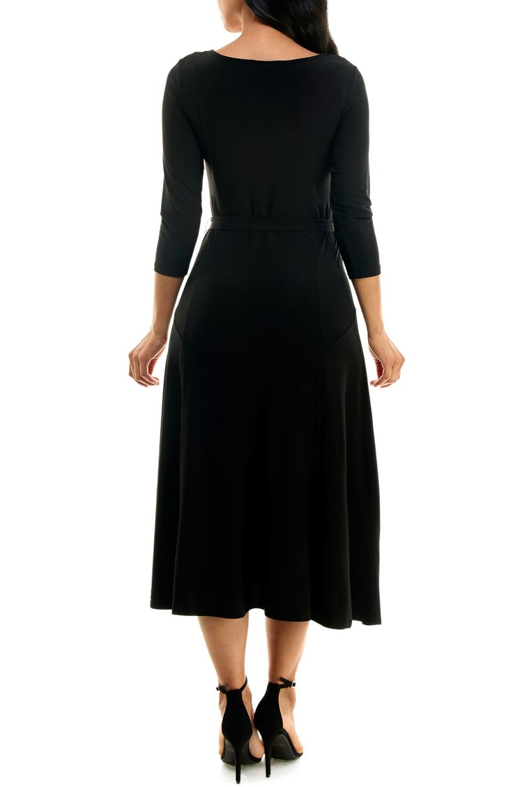 A twirl-worthy, tea-length skirt brings an elegant balance to a solid work-to-weekend dress fashioned from a stretch jersey for a sensible fit. 48" length Bateau neck Three-quarter length sleeves Waist belt 95% polyester, 5% spandex Machine wash, tumble dry Imported Model stats: 5'10" height, 32" bust, 25" waist, 36" hip. Model is wearing size Small. Black Stretch A-line Midi Dress, Fitted A-line Maxi Dress In Solid Color, Black A-line Fit And Flare Maxi Dress, Stretch Midi Dress For Formal Occasions, Black A-line Midi Dress In Elastane, Stretch A-line Midi Dress For Work, Fitted Black Wrap Dress For Fall, Solid Color Elastane A-line Dress, Black 4-way Stretch Dress