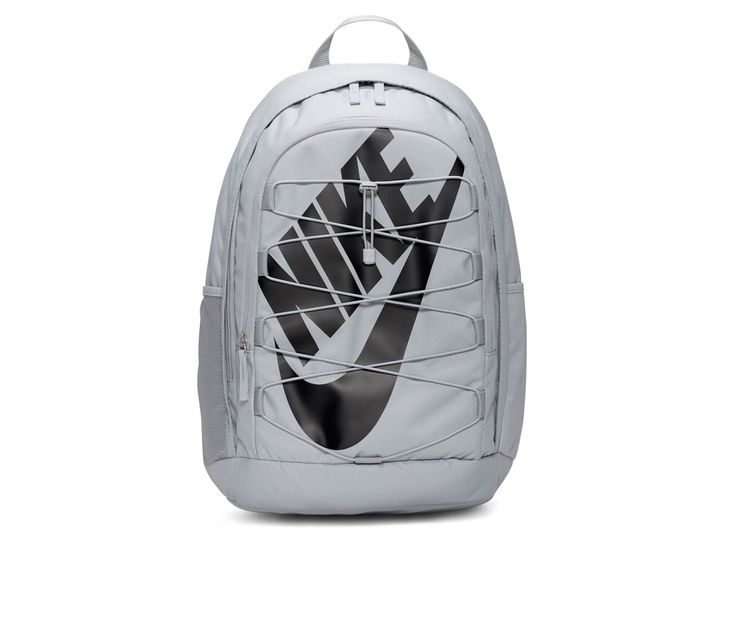 the nike backpack is white with black and grey print on the front, it's zipper