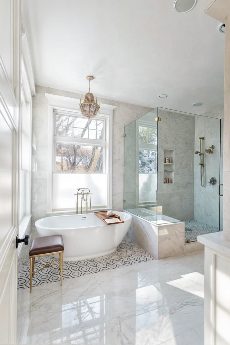 a bathroom with a large tub and walk in shower next to a window on the wall