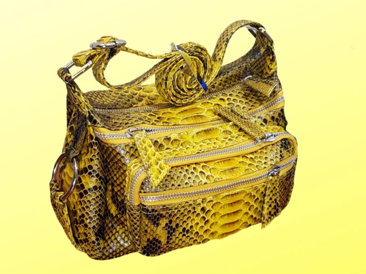 Introducing our one-of-a-kind Unique Diaper Bag with Exotic Python Snakeskin - the ultimate crossbody bag for stylish moms on-the-go! Made from luxurious python snakeskin leather, this women bag is not only functional but also incredibly chic. Say goodbye to boring diaper bags and hello to a statement piece that will turn heads wherever you go. This versatile diaper bag doubles as a messenger bag, travel bag, and even a gym bag - making it the perfect accessory for all your daily activities. The genuine python snakeskin leather adds a touch of sophistication, while the suede interior lining ensures durability and comfort. With a premium metal zipper closure, front pockets, and back pocket, you'll have easy access to all your essentials. Product Details: - Genuine python snakeskin leather - Snakeskin Purse, Snake Skin Bag, Stylish Mom, A Gym, Diaper Bags, Bag Travel, Women Bag, Daily Activities, Python