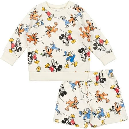 Give your little one the gift of Disney magic with this cute and stylish Disney outfit! This comfy sweatshirt and shorts set features an easy-to-dress pullover design and colorful artwork of your kid's favorite Disney characters. Watch your kid go on adventures with iconic characters like Mickey Mouse, Goofy, Donald Duck, and Pluto; Winnie the Pooh; and Simba, Timon and Pumbaa from The Lion King! Made of a soft French Terry material that keeps your child comfortable, this fashionable Disney set Lion King Toys, Sweatshirt And Shorts, Sweatshirt Shorts, Mickey Mouse Donald Duck, Mickey Mouse Sweatshirt, Baby Mouse, Mickey Mouse Clubhouse, Boys Sweatshirts, Kids Clothes Boys