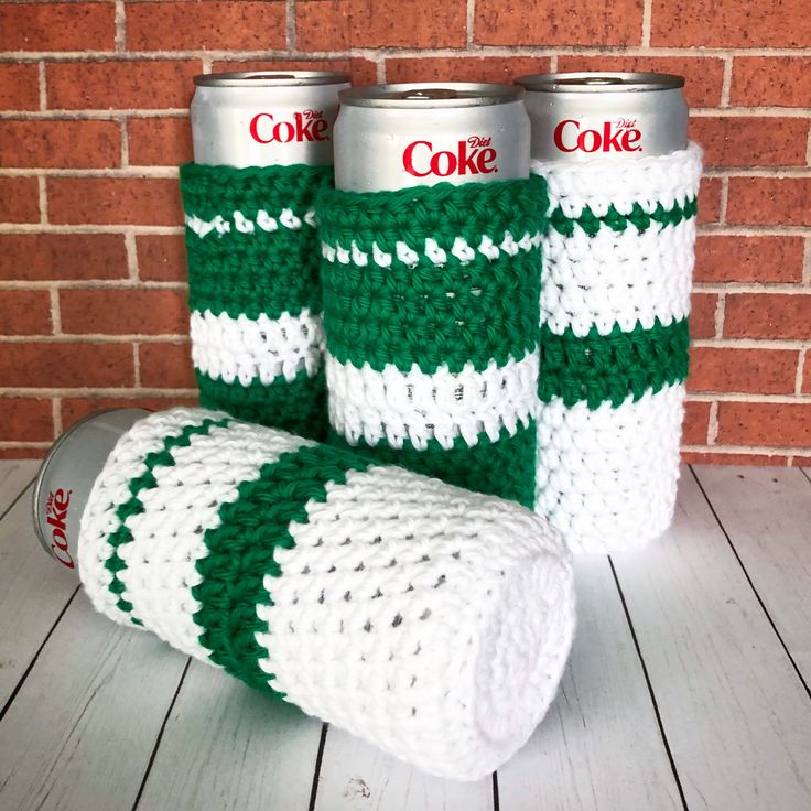 three crocheted can cozyies sitting next to each other