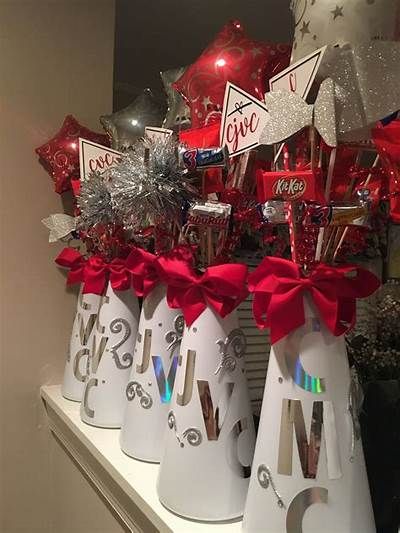 some red and silver decorations are on a shelf