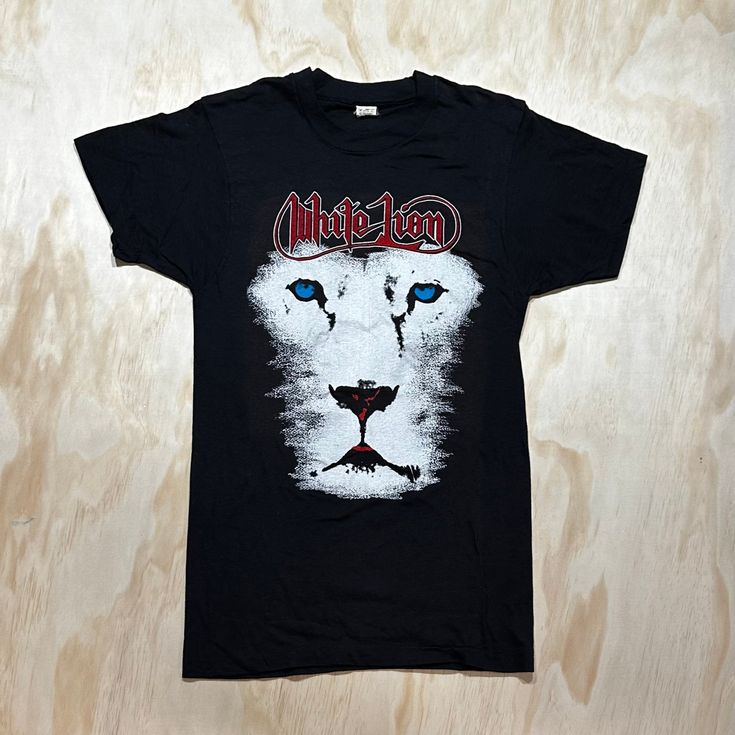 "D E T A I L S *  VTG 1988 White Lion Concert Tour t-shirt * White Lion Concert Tour  * \"The Pride In America Tour\" featuring the band on the back * Made in USA * Single Stitch  S P E C I F I C S Label:  Screen Stars  Tag Size: Medium Fits Like: Small Colour: Black Material: Cotton  Condition: Excellent Vintage Condition.  M E A S U R E M E N T S  Pit to pit: 18\" Length: 29\" Please refer to our sizing guide if you require additional sizing information. www.etsy.com/shop/MintageClothingCo/policy ✭ visit the rest of the shop ✭ www.etsy.com/shop/MintageClothingCo INSTAGRAM: Mintage FACEBOOK: MintageClothingCo TWITTER: MintageClothing" Hawaii Surf, White Lion, Sweet T, The Pride, Tour T Shirts, In America, Unisex Hoodies, Made In Usa, Lion