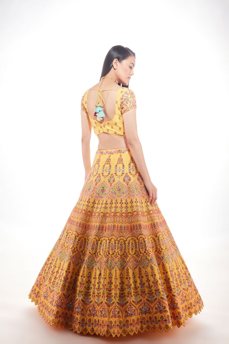 A yellow silk lehenga with fine multi-hued resham embroidery with a touch of sequins and glass beads paired with a matching blouse and mauve pink net dupatta From Chamee and Palak 's The Wedding Edit collectionDELIVERY TIMEPlease allow 8-12 weeks for your outfit to arrive.FABRIC DETAILSSilk And NetProfessional cleaning only. Yellow Cutdana Sets For Reception, Elegant Yellow Dola Silk Anarkali Set, Yellow Cutdana Sharara For Reception, Yellow Raw Silk Dress For Reception, Yellow Art Silk Dress For Reception, Yellow Anarkali Set For Reception, Yellow Mirror Work Sets For Reception, Yellow Sets With Mirror Work For Reception, Yellow Silk Wedding Sets