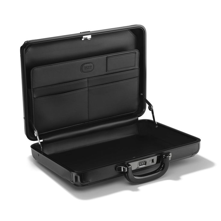 Forged from the same durably sophisticated brushed aluminum and design references as our Pursuit Aluminum Travel Cases, the Pursuit Attaché Case makes a striking impression in every environment. With such exceptional attributes as a bespoke, ergonomic handle designed to complement the case color, a combination lock for security, and a sleek, coated leather interior, this elevated attaché is a step above any briefcase. Enduring as a classic automobile, the ZH Pursuit Aluminum Medium Attaché Case Classic Business Protective Case, Classic Protective Business Case, Classic Business Case, Elegant Rectangular Case For Business Trips, Elegant Rectangular Cases For Business Trips, Work Essentials, Combination Locks, Business Bag, Brushed Aluminum