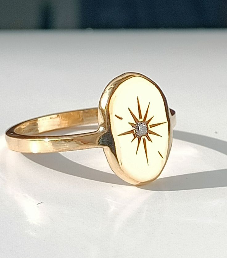 Collection : '' I see lots of stars but none of them is you'' 925 sterling silver 14K Gold Price for 1 ring. Weight for 925 Silver : 3,40gr (approximate) Weight for 14K Gold : 4,50 gr (approximate) FREE Fedex Express Shipping 2-7 business days to Worldwide ✦ Registered mail which require a signature ✦ We need your phone number for Fedex/TNT receipts. ✦ We can't send to PO BOX adresses. Celestial Gold Signet Ring Stamped 14k, Gold Celestial Signet Ring Stamped 14k, Star-shaped Yellow Gold Rings With Polished Finish, Heirloom 14k Gold Star Rings, Yellow Gold Star-shaped Signet Ring For Anniversary, Celestial 14k Gold Hallmarked Rings, Yellow Gold Starburst Fine Jewelry, Anniversary Starburst Jewelry With Diamond Accents, Star-shaped Signet Ring In 14k Gold For Anniversary