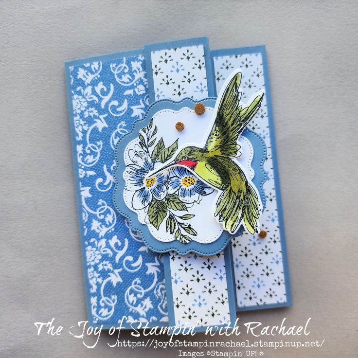 a blue and white card with a bird on it