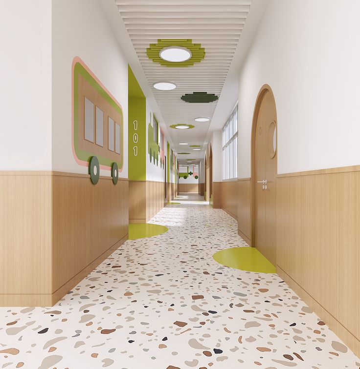 an empty hallway with green and white decor