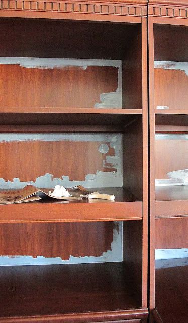 an empty bookcase with some books on it