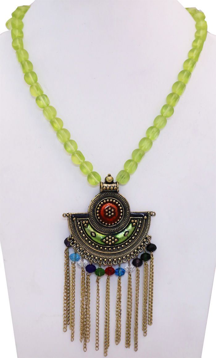 Lime colored glass beads and a longer two-level ethnic gold-toned engraved pendant with a shiny gemstone-like center core defines this modern look tribal necklace. Multicolored beads and the chain extensions give it a tribal look. This necklace does not have a clasp. Bohemian Brass Jewelry With Polished Beads, Gold Bohemian Beads For Jewelry Making, Bohemian Gold Beaded Necklaces With Round Pendant, Bohemian Gold Beaded Round Pendant Necklaces, Bohemian Gold Beaded Necklace With Round Pendant, Bohemian Gold Beaded Pendant Necklace, Bohemian Brass Necklace With Polished Beads, Bohemian Metal Beaded Necklaces With Large Beads, Green Bohemian Metal Beaded Necklaces