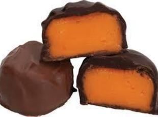 three pieces of chocolate covered caramel candy