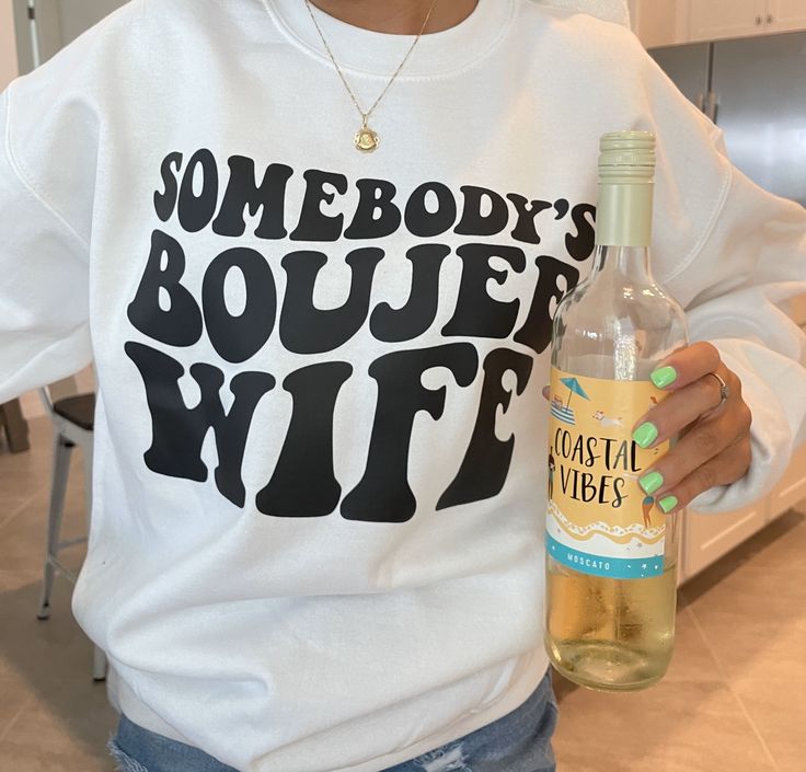 Our "Somebody's Boujee Wife" white sweatshirts are the perfect addition to your wardrobe for the fashion-forward and confident woman! Wear it to brunch with the girls, out for a casual date night with your significant other, or just lounging at home for a cozy and stylish look. The relaxed fit makes them easy to layer with your favorite pieces. Embrace your boujee side and add this must-have sweatshirt to your collection today! Casual Date Night, Casual Date, Confident Woman, Significant Other, White Sweatshirt, Date Night, Fashion Forward, Relaxed Fit, Sweatshirts