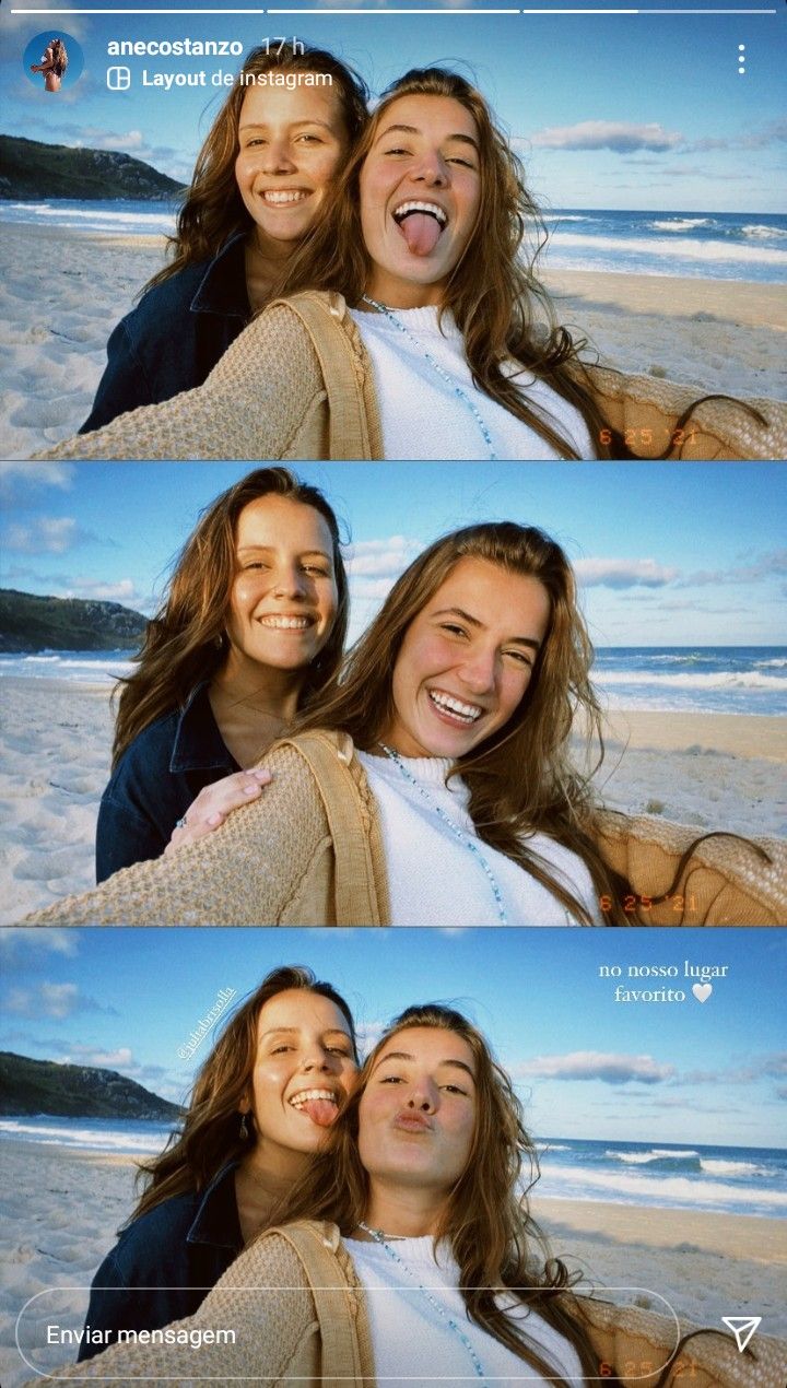 two women are smiling and hugging on the beach