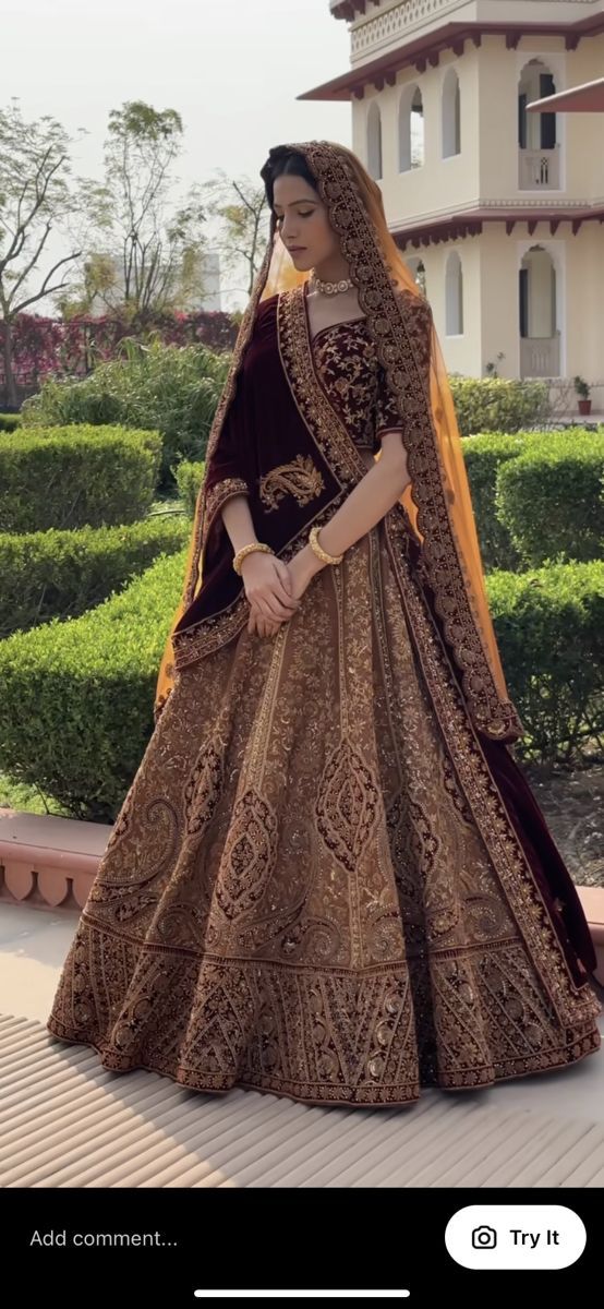 a woman in a brown and gold bridal gown