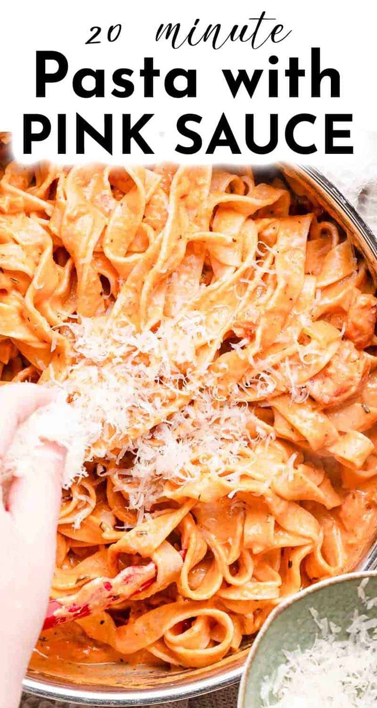 someone is sprinkling parmesan cheese on top of pasta in a pan