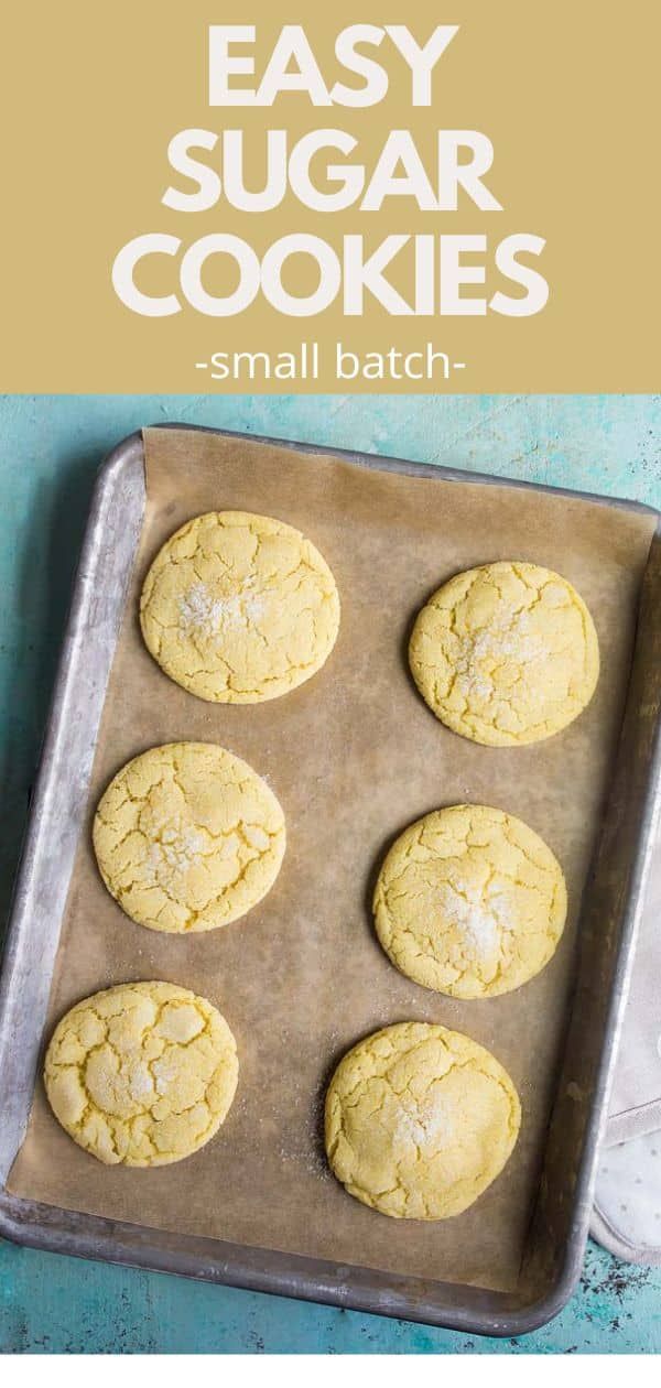 easy sugar cookies on a baking sheet with text overlay that reads, easy sugar cookies - small batch