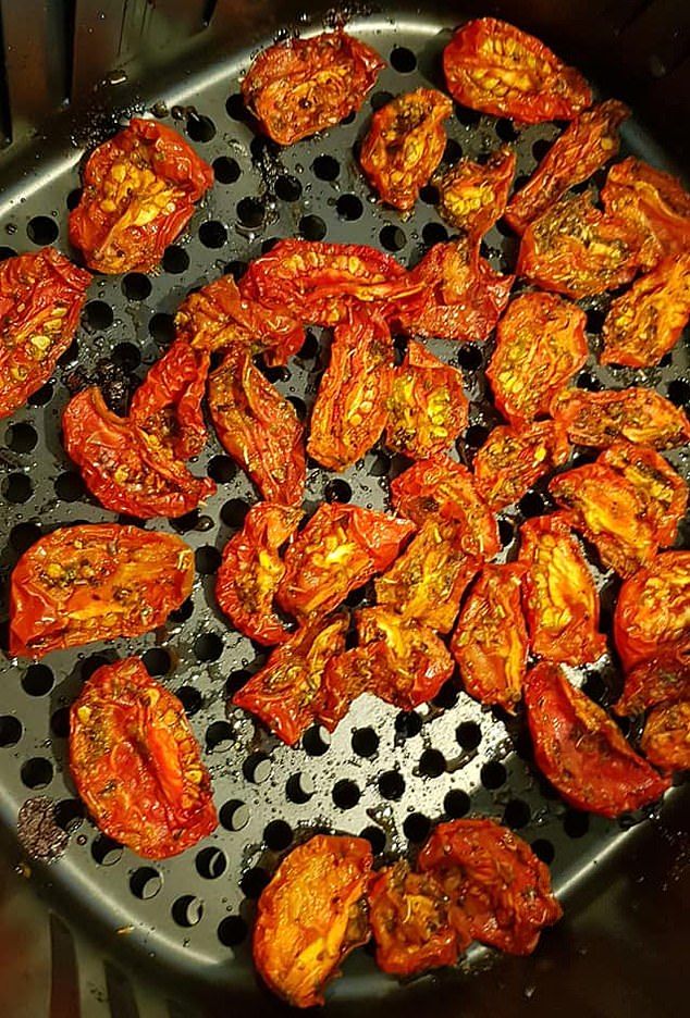 tomatoes being cooked in a frying pan on the stove