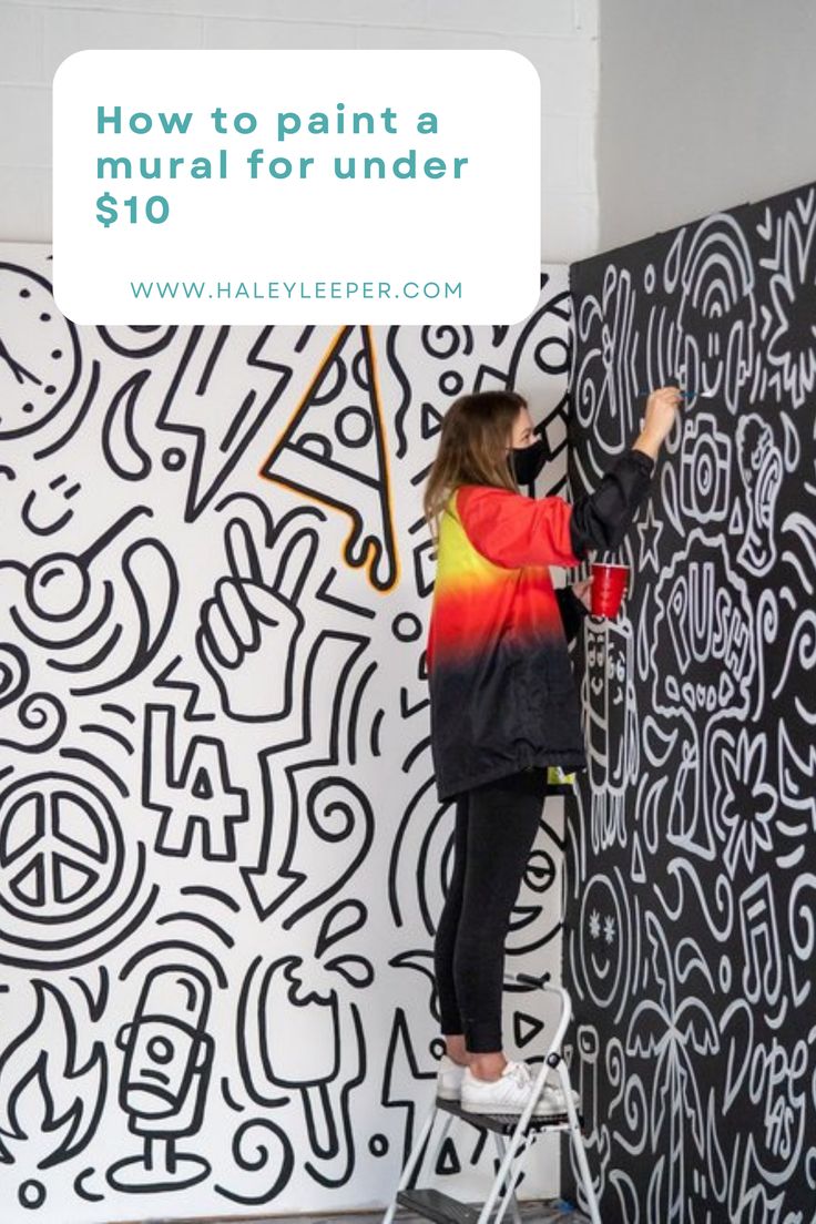 a woman painting a mural on the side of a wall with words how to paint a mural for under $ 10