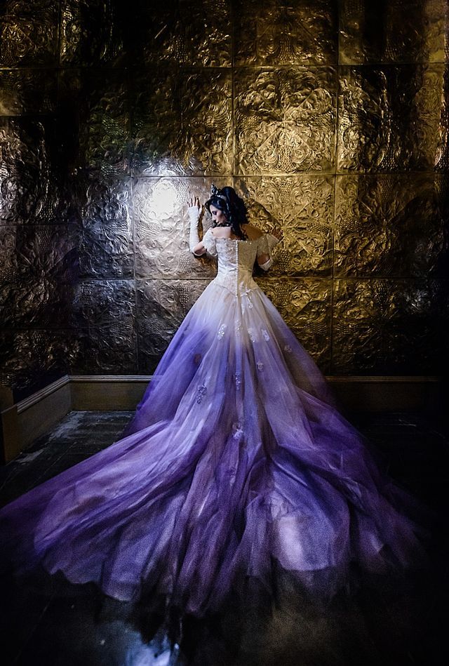 a woman in a purple and white dress