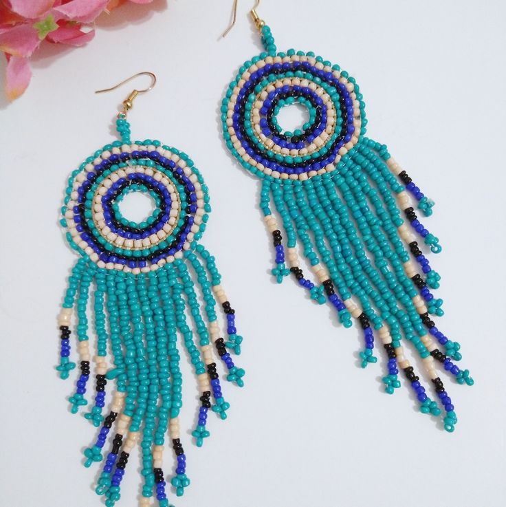 Seed Bead Turquoise Dangle Earrings In New Condition! Bead Colors: Turquoise, Black, White And Blue Earring Size: 4.75" X 1.5" Turquoise Dangle Earrings, Turquoise Earrings Dangle, Earrings Color, Blue Earrings, Seed Bead, Blue And Silver, Jewelry Crafts, Seed Beads, Crochet Earrings