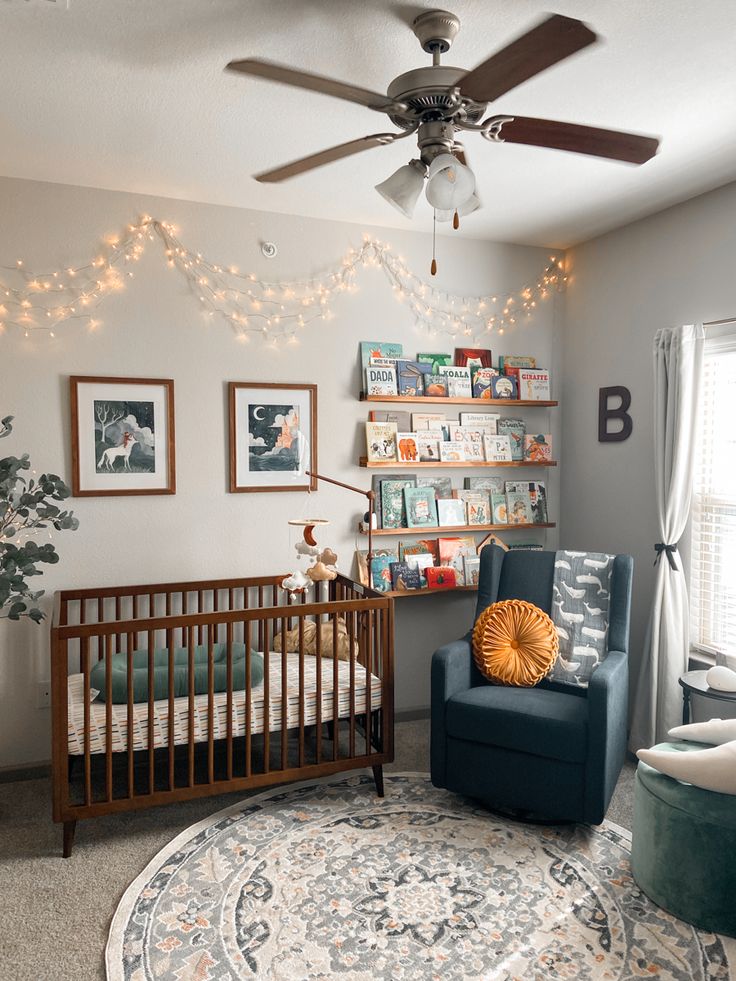 a baby's room with a crib, rocking chair and bookshelf