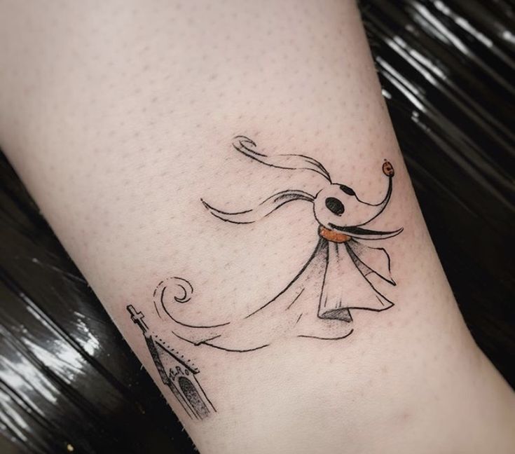 a woman's leg with a tattoo on it