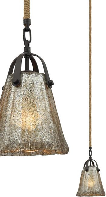 two light fixtures hanging from a rope and glass lamp fixture with an old fashioned bell shade