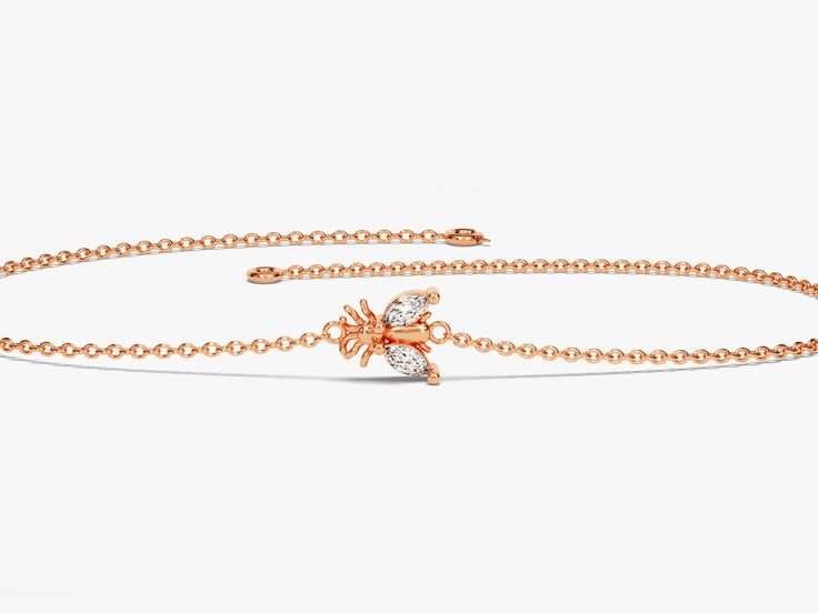 A luxurious addition to any ensemble, this Diamond Bee Bracelet in 14k Gold exudes glamour and sophistication. Featuring a 14k Gold setting and a shimmering Diamond Bee charm, this is the perfect piece for those with a taste for high-end fashion. Features• Made to Order• Gold Kt: 14K• Gold Color: Rose Gold, Yellow Gold, White Gold• Gem Stone: Natural White Diamonds• Diamond Cut: Marquise• Number of Stones: 2• Available Stone Sizes: 2 x 1.50 x 3.00 mm• Total CTW: 0.05 ct• Diamond Color - Clarity: Fine Jewelry Rose Gold Cubic Zirconia Chain Bracelet, Fine Jewelry Rose Gold Bracelets In 14k Gold, Rose Gold Diamond Cut Bracelet With Cubic Zirconia, Rose Gold Cubic Zirconia Chain Bracelet Fine Jewelry, Fine Jewelry Rose Gold 14k Bracelets, Rose Gold Cubic Zirconia Bracelet With Diamond Cut, Rose Gold Cubic Zirconia Bracelets With Diamond Cut, Rose Gold Cubic Zirconia Chain Bracelet, Rose Gold 14k Diamond Cut Bracelet