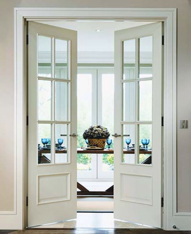 an open door leading to a dining room