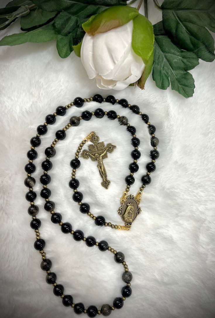 WELCOME TO OUR SHOP  This is Gorgeous Immaculate heart of Mary handmade Custom Rosary! Made from 8mm Obsidian Natural Stone! Stunning centerpiece medal & unique crucifix! Top quality is no exception, thoughtfully designed and carefully made with the finest material.  Custom orders with personalized names, pictures and bulk orders are AVAILABLE :) Thank you for choosing us for your special occasion (Baptism, Birthday,  Communion, Wedding, anniversary). Add our shop to your favorites so you can be Elegant Rosary With 8mm Beads And Crucifix, Adjustable Elegant Crucifix Rosary, Gold Rosary With Gemstone Beads Gift, Elegant Adjustable Crucifix Rosary, Elegant Adjustable Rosary With Crucifix, Gift Rosary With Round Natural Stones, Elegant Rosary With Round Beads For Healing, Round Beads Rosary With Natural Stones For Gift, Elegant Healing Rosary With Round Beads