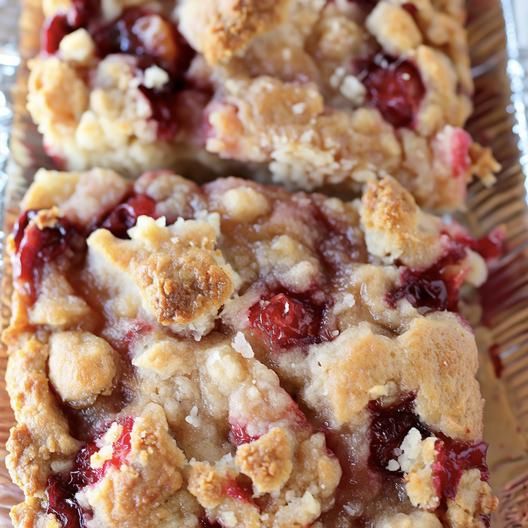 two pieces of cherry crumbler bars on a plate