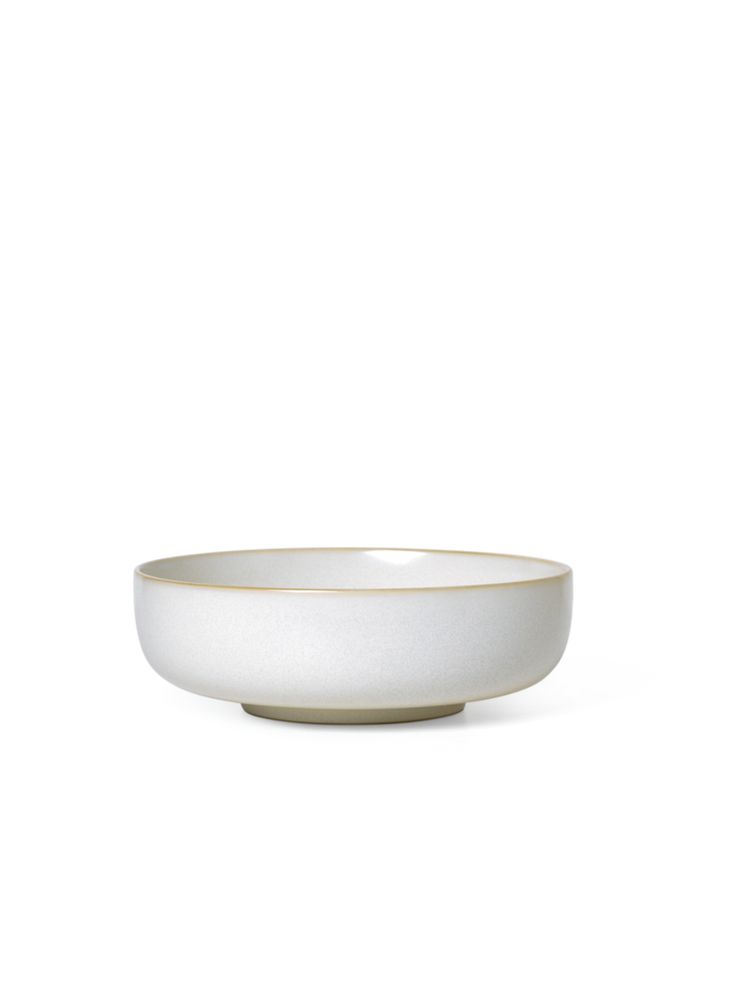 a white bowl sitting on top of a table