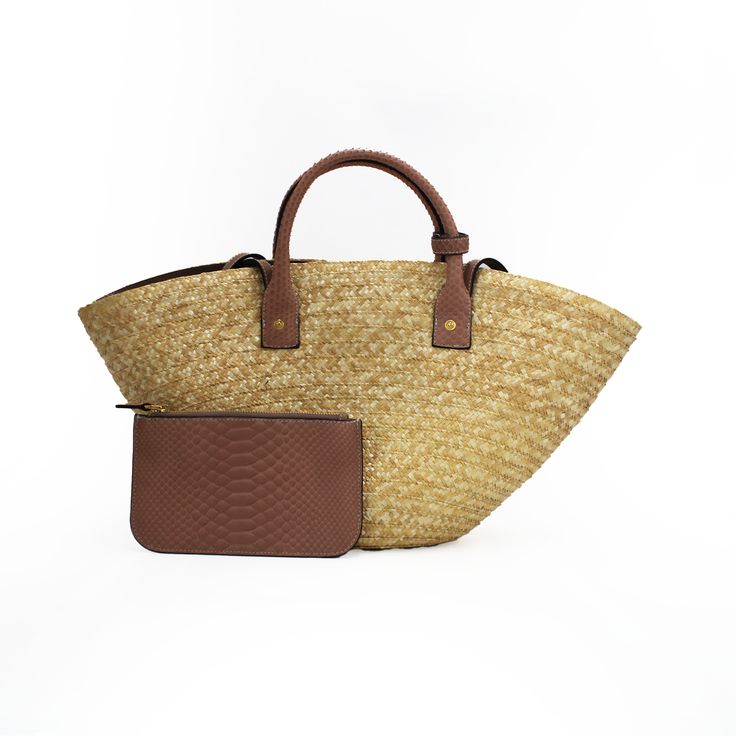 Meet Bianca, the ultimate summer accessory, a chic tote made of natural raffia and luxurious python skin handcrafted in Italy. This versatile bag is designed for both style and function, featuring a spacious interior to carry all your essentials for a day out in the sun. It comes with a practical detachable pouch, perfect for organizing smaller items, which can also transform into an elegant clutch for evening occasions. The tote´s adjustable strap allows it to be worn comfortably as a shoulder bag, making it the ideal companion for both casual outings and sophisticated soirées. Details Natural Raffia Interior pockets Python skin 11"H x 22" Top W x 5" D x 8.5" Bottom W Made in Italy *A portion of the proceeds of the sale of this bag will benefit the Fish & Wildlife Foundation of Florida. Luxury Rectangular Beach Bag For Shopping, Luxury Beach Bag For Vacation, Luxury Woven Leather Straw Bag For Travel, Luxury Woven Leather Shoulder Bag For Vacation, Luxury Double Handle Beach Bag For Travel, Elegant Woven Leather Beach Bag For Travel, Luxury Woven Leather Bucket Bag For Vacation, Luxury Natural Straw Bag For Shopping, Luxury Straw Bag With Leather Handles For Daily Use