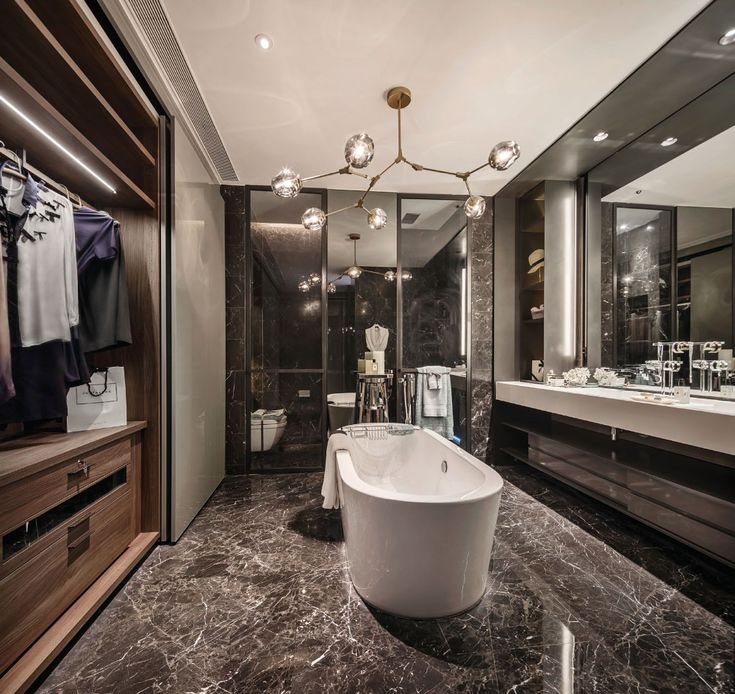 a bathroom with a large bathtub next to a walk in shower