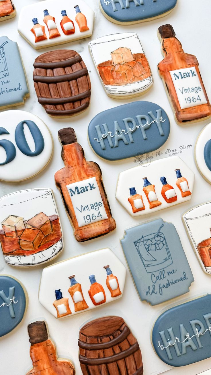 decorated cookies are arranged in the shape of whiskey bottles and barrels with happy birthday written on them