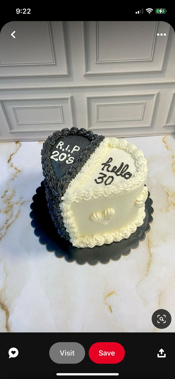 two heart shaped cakes sitting on top of a counter next to a white cabinet door