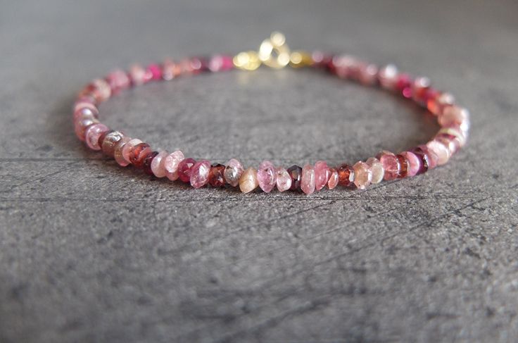 This is a skinny pink shaded bracelet with tiny Rhodolite Garnet, Pink Garnet and pink Tourmaline genune gemstones The gemstone are strung on the highest quality metal strand beading wire,which is extremely strong and flexible. The gemstones measure 2 -3 m in diameter. The bracelet closes with a gold filled spring ring clasp The length of the bracelet is 18 cm inch 7.08 I can always add an extension chain at no extra charge Thanks for stopping by. See my other handcrafted precious jewels here: h Pink Gemstone Beaded Bracelets For Jewelry Making, Dainty Pink Jewelry With Gemstone Beads, Pink Ruby Bracelets As Gift, Dainty Pink Beaded Bracelets With Gemstone Beads, Dainty Pink Bracelets With Gemstone Beads, Handmade Pink Crystal Dainty Bracelet, Dainty Pink Bracelets With Faceted Beads, Dainty Pink Gemstone Bead Bracelets, Dainty Pink Bracelet With Natural Stones