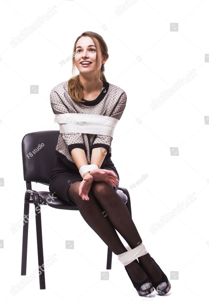 a woman sitting on a chair with bandages around her ankles and legs, smiling at the camera