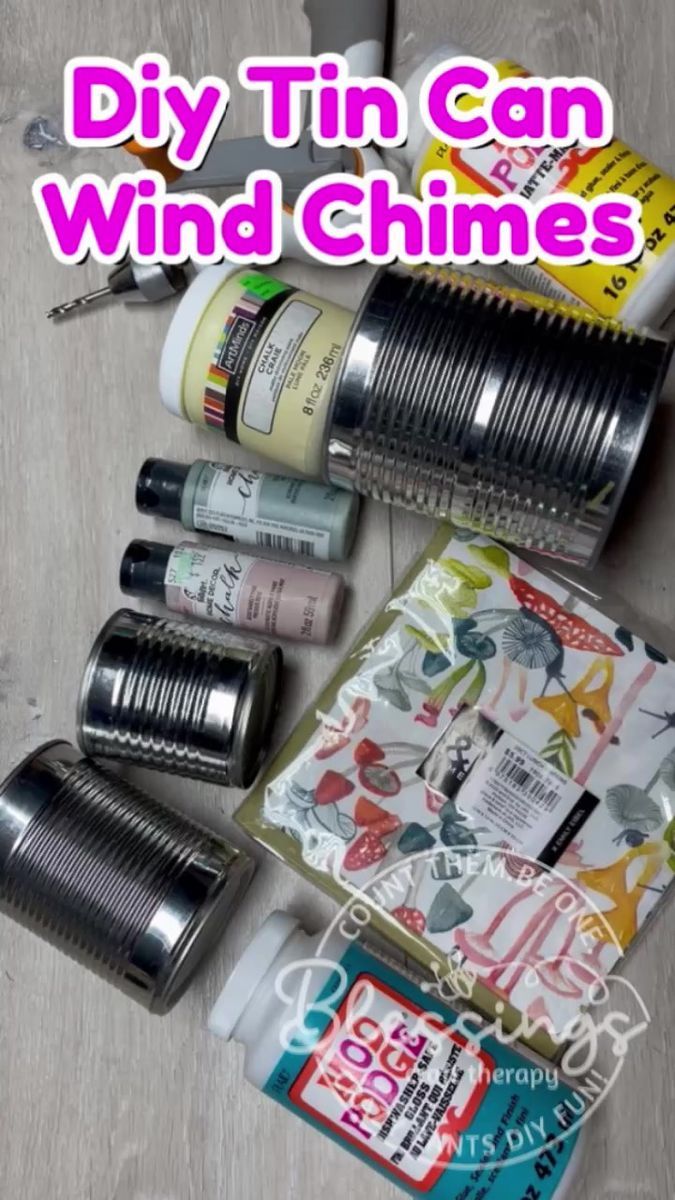 some tin can wind chimes are laying on the floor next to each other with text overlay that says diy tin can wind chimes