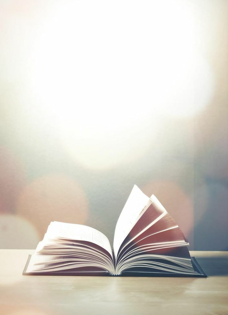 an open book sitting on top of a table