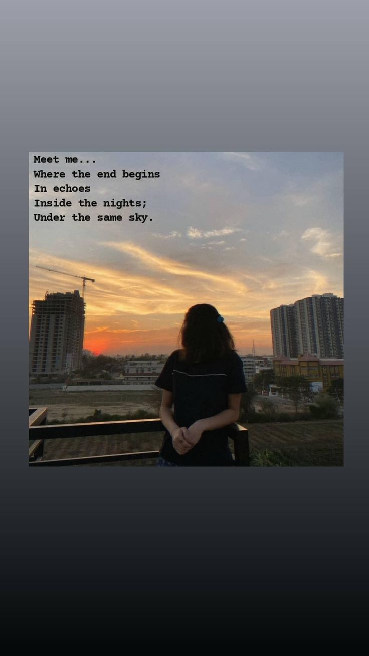 a woman standing in front of a sunset with her arms crossed and looking at the sky