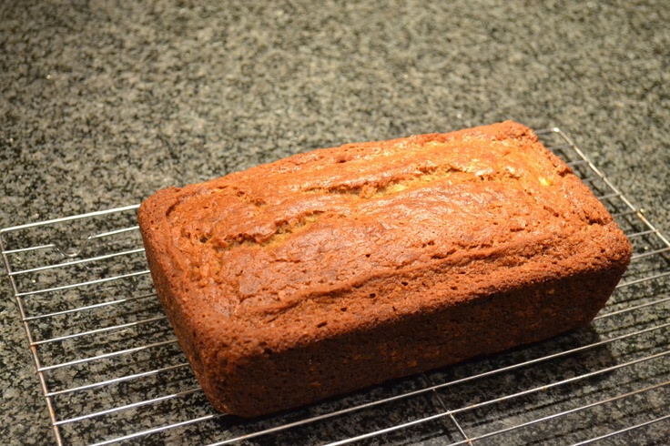 a loaf of bread sitting on top of a metal rack