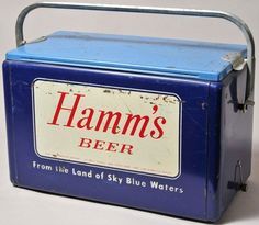 an old blue metal box with the words hamm's beer on it