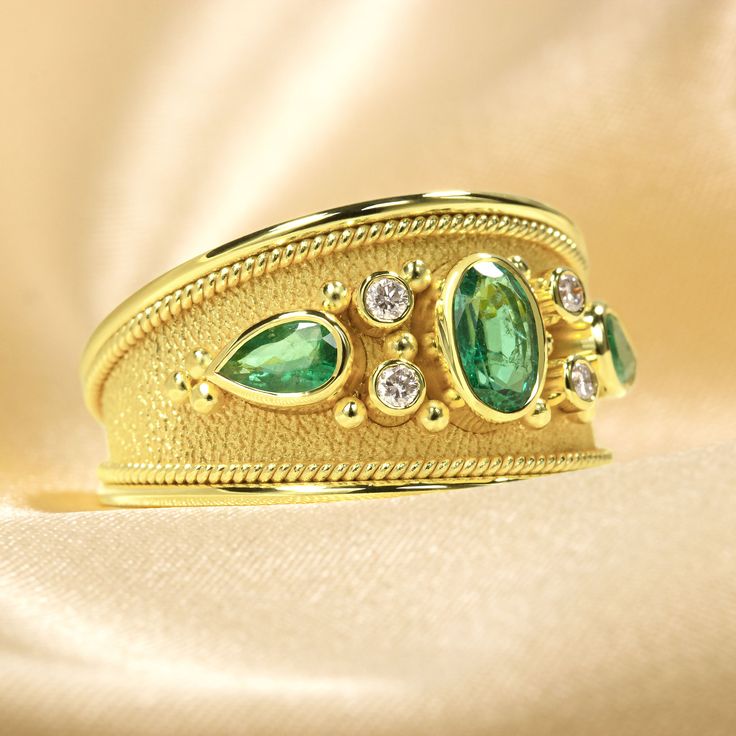 Make an unforgettable entrance with this dazzling gold Emerald Ring - encrusted with dazzling diamonds and fit for royalty! It's the perfect pick to add extravagant style and sparkle to your wardrobe and make an undeniable statement! 100% handmade in our workshop. Metal: 14K Gold| 18K Gold Gemstones: Emeralds | weight 0,68 ct Diamonds | weight 0,08 ct Discover the art of personalization as you select your dream jewelry, choosing the perfect gemstone that resonates with your unique style. Our ded Luxury Gold Emerald Round Ring, Luxury Gold Emerald Ring, Luxury Gold Oval Emerald Ring, Gold Emerald Ring With Diamond Accents, Luxury Gold Emerald Ring For Formal Occasions, Luxury Yellow Gold Emerald Ring With Single Cut Diamonds, Opulent Yellow Gold Diamond Jewelry, Gold Emerald Diamond Ring With Accents, Gold Rings With Single Cut Diamonds And Emerald