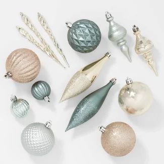 christmas ornaments are arranged on a white surface