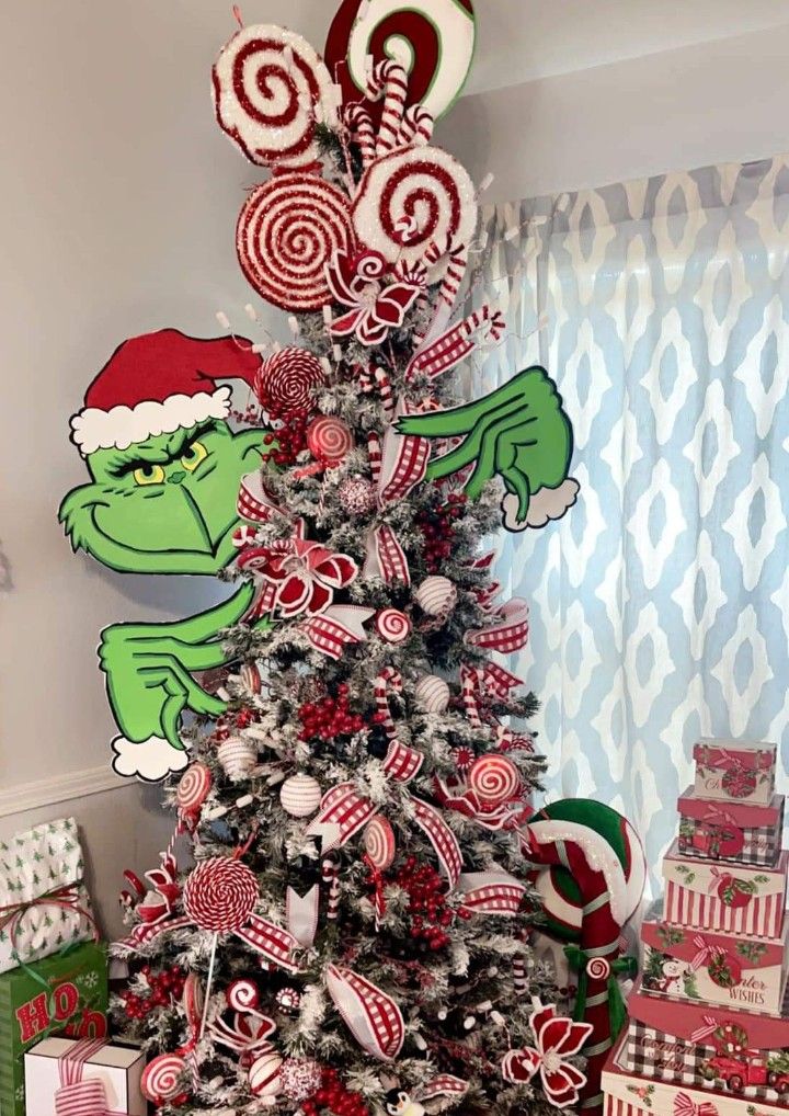 a christmas tree decorated with lollipops and candy canes