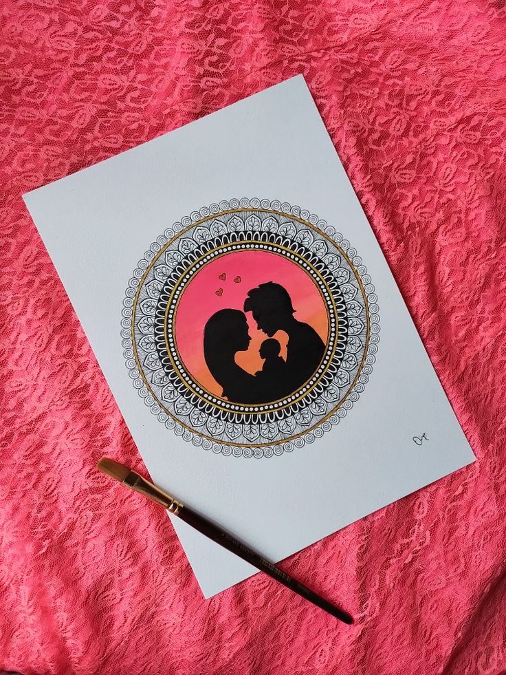 a couple kissing in front of a pink background with a black and gold design on it